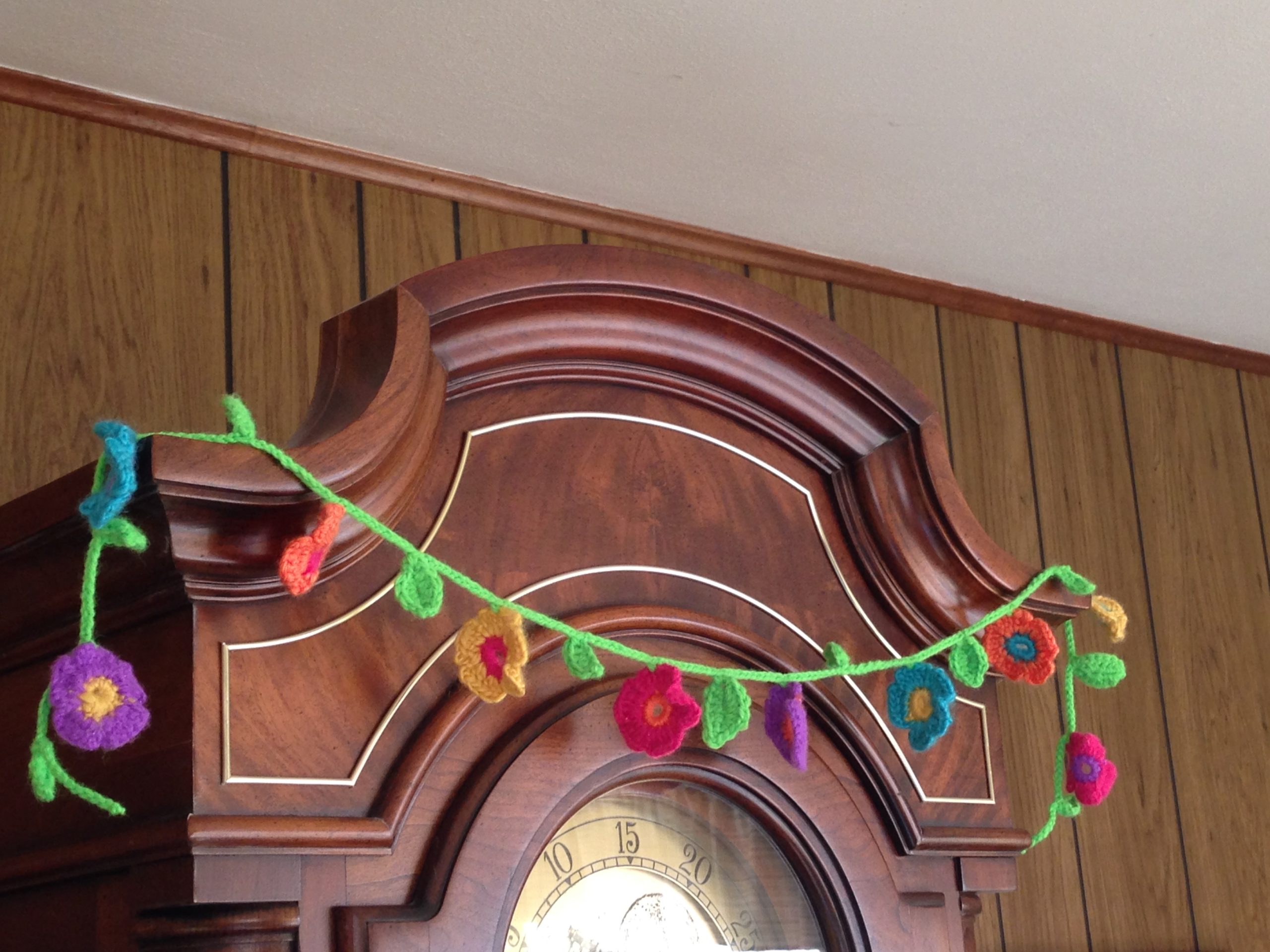 flower chain on grandfather's clock