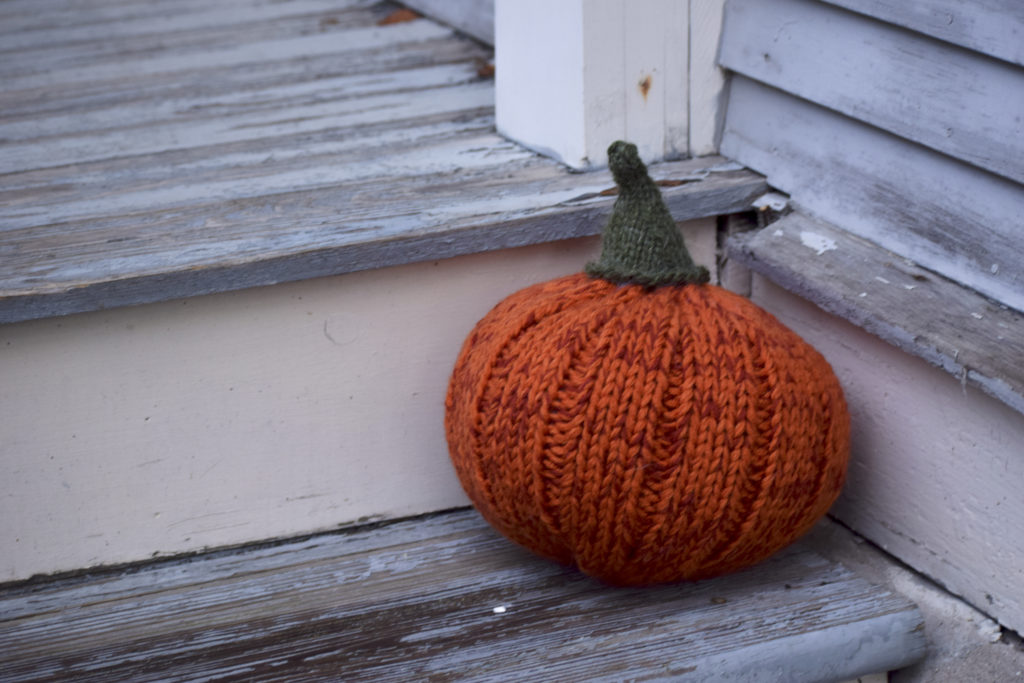 pumpkin pouf on steps