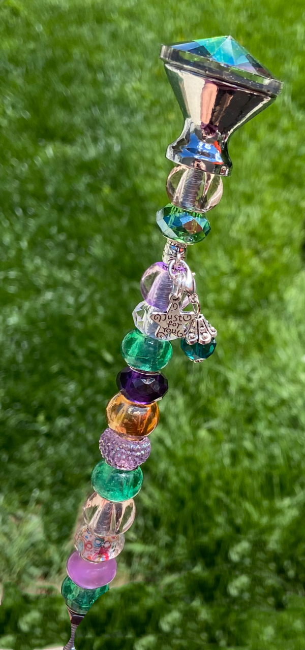 fairy wand with iridescent top and purple, pink, and green beads