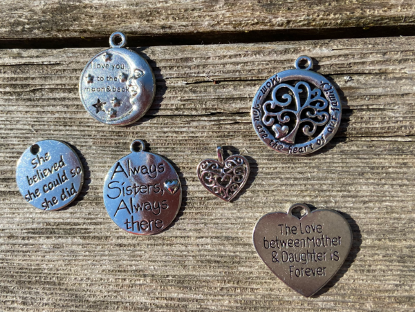 a collection of charms with warm affirmations for moms