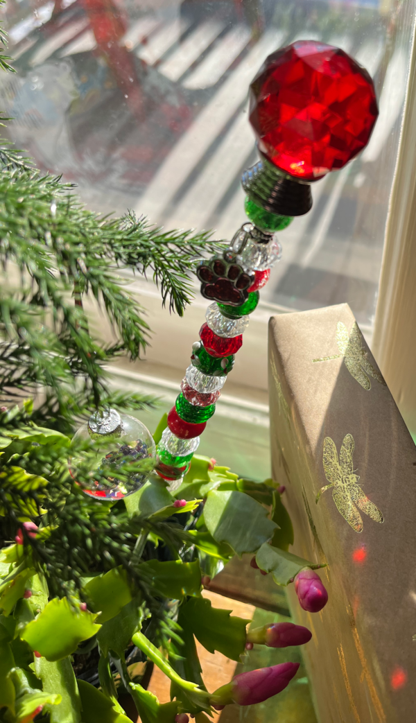 fairy wand with red round crystal top and red, green, and white beads